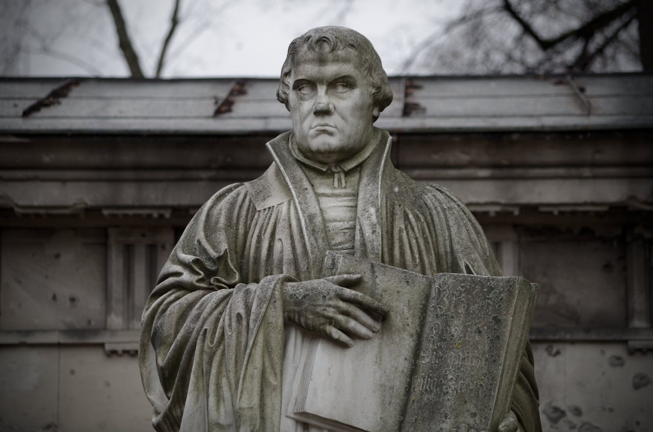 Close-up of the Martin Luther statue holding a book in Berlin, Germany.